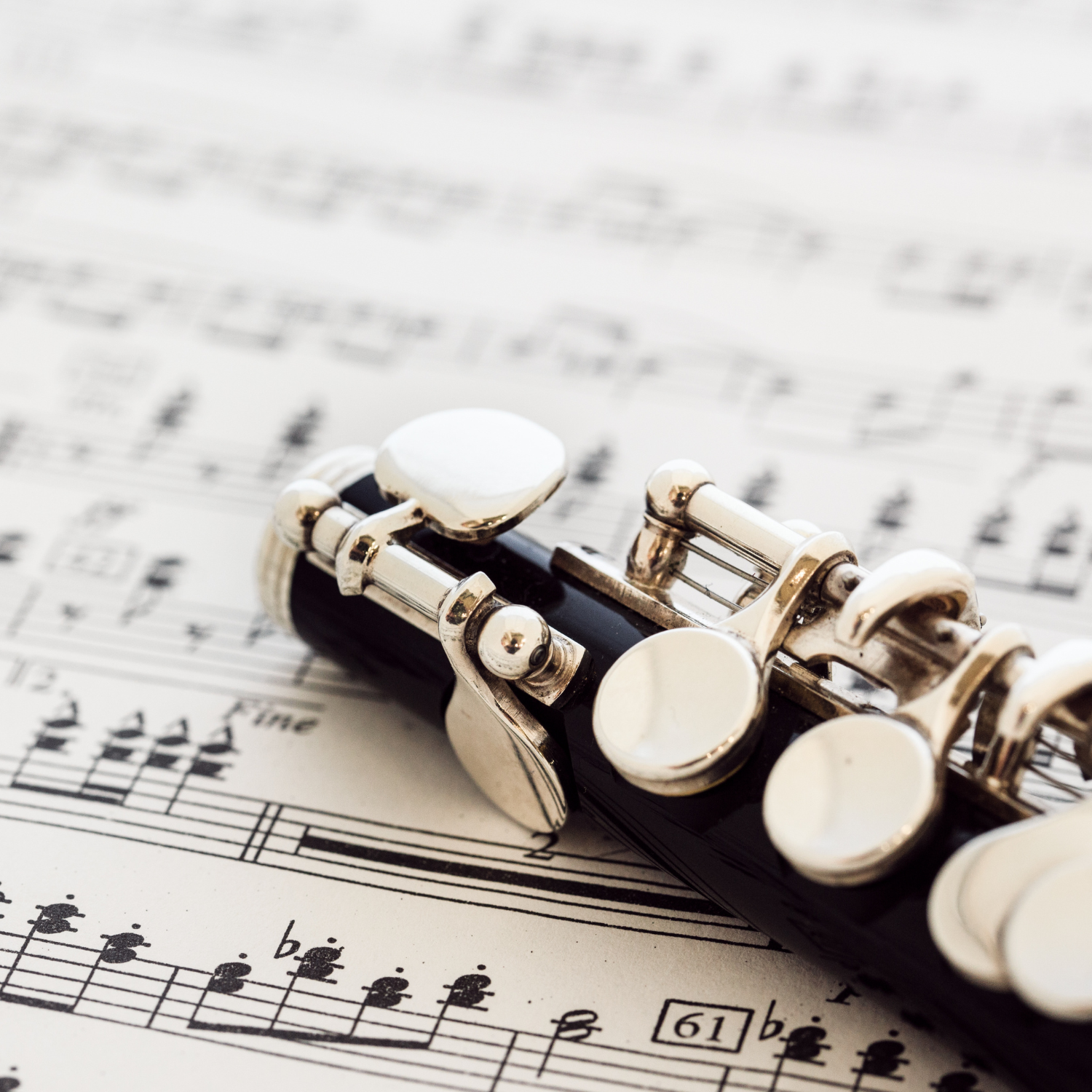wooden piccolo on sheet music