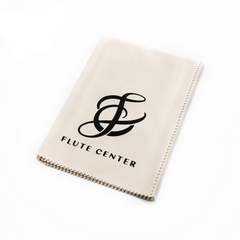 A beige microfiber cleaning cloth with the Flute Center logo printed in black.