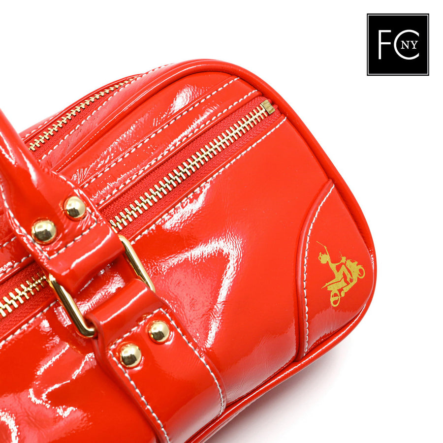 Red patent leather handbag